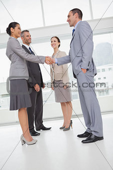 Work team shaking hand with their new partner