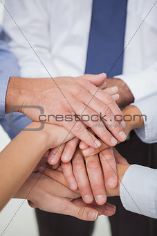 Close up on work teams hands all together