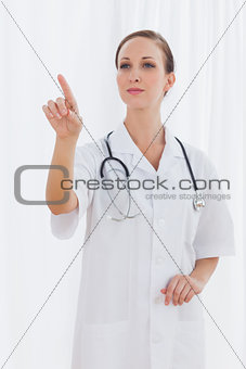 Smiling nurse pointing at something