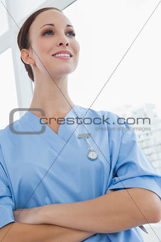 Smiling surgeon posing looking away