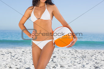 Sexy body in white bikini with beach ball