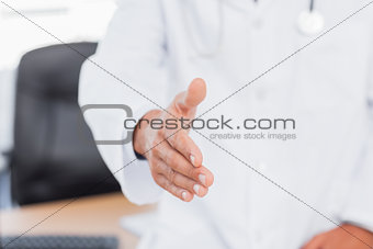 Doctor presenting his hand for a handshake