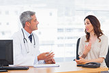 Patient talking with her doctor about illness