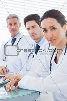 Doctors looking at camera