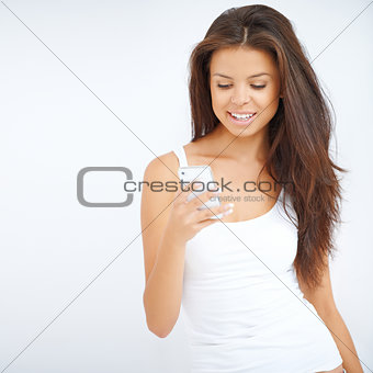 Young woman reading a message on her phone
