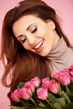 Laughing beautiful woman with roses