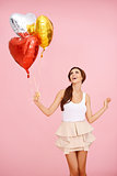 Cute brunette with balloons