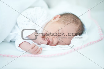 Adorable Baby Girl is Sleeping on Bed