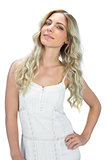 Content sensual model in white dress posing