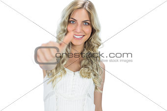 Positive seductive model in white dress thumb up