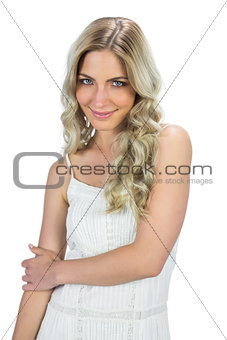 Content sensual blond woman posing touching her arm