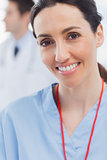 Cheerful nurse smiling at camera