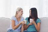 Friends drinking coffee and laughing