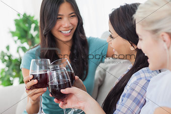 Chatting friends having red wine together