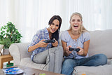 Happy friends playing video games and having fun