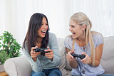 Silly friends playing video games and laughing
