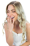 Cheerful blond model laughing