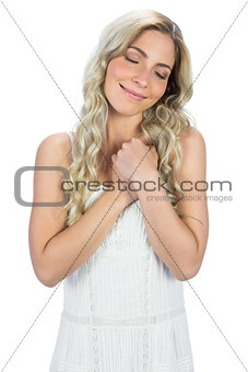 Content curly haired blonde dreaming