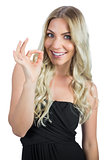 Cheerful gorgeous blonde in black dress gesturing