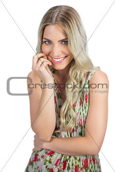 Seductive blonde wearing flowered dress posing