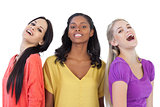 Diverse young women laughing at camera