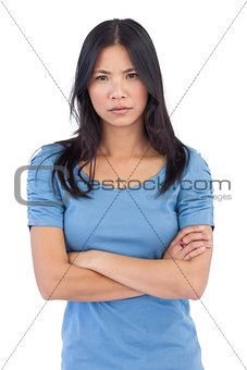 Annoyed asian woman with arms crossed