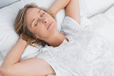 Woman sleeping peacefully in bed