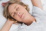Woman sleeping peacefully in bed close up