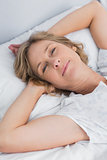 Woman lying peacefully in bed