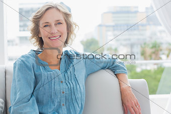 Happy woman relaxing on her couch