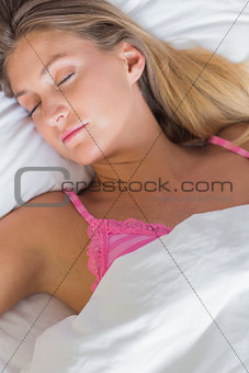 Peaceful blonde sleeping in her bed