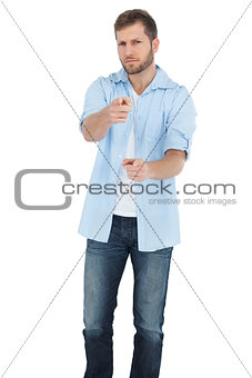 Confident model pointing at camera