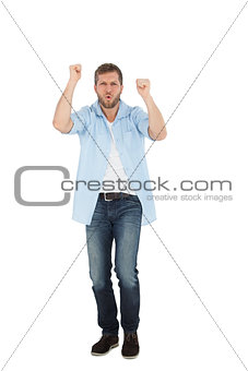 Cheerful casual man cheering