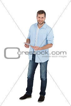 Happy male model using his tablet pc
