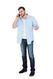Relaxed male model posing while making a call