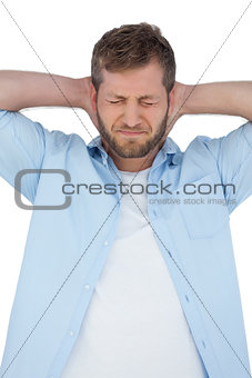 Trendy model having a painful neck and closing eyes