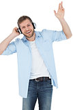 Cool trendy model listening to music and smiling