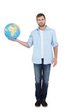 Charming young model holding a globe