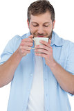 Relaxed casual model holding a mug