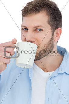 Casual young model drinking a coffee