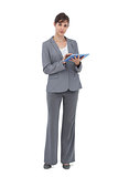 Businesswoman posing with tablet computer