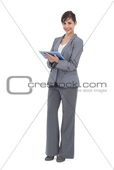 Smiling businesswoman with tablet computer