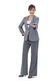 Happy businesswoman holding tablet pc
