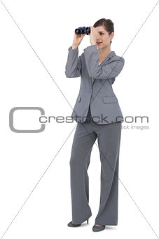 Businesswoman with binoculars