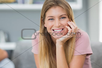 Smiling woman sitting on couch