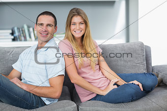 Relaxed couple sitting on the couch together