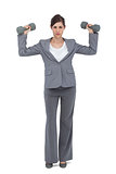 Businesswoman posing with dumbbells