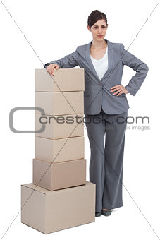 Businesswoman with cardboard boxes