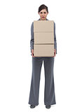 Businesswoman holding cardboard boxes