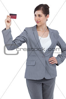 Confident businesswoman with credit card